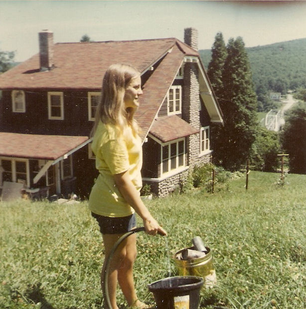 Gay DeHart watering her horse